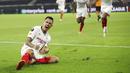 Pemain Sevilla, Lucas Ocampos, melakukan selebrasi usai mencetak gol ke gawang Wolverhampton Wanderers pada perempat final Liga Europa, Selasa (11/8/2020). Sevilla menang dengan skor 1-0. (Friedemann Vogel, Pool Photo via AP)