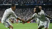 Cristiano Ronaldo (kiri) saat masih bermain di Real Madrid bersama Marcelo. (foto: JAVIER SORIANO / AFP)