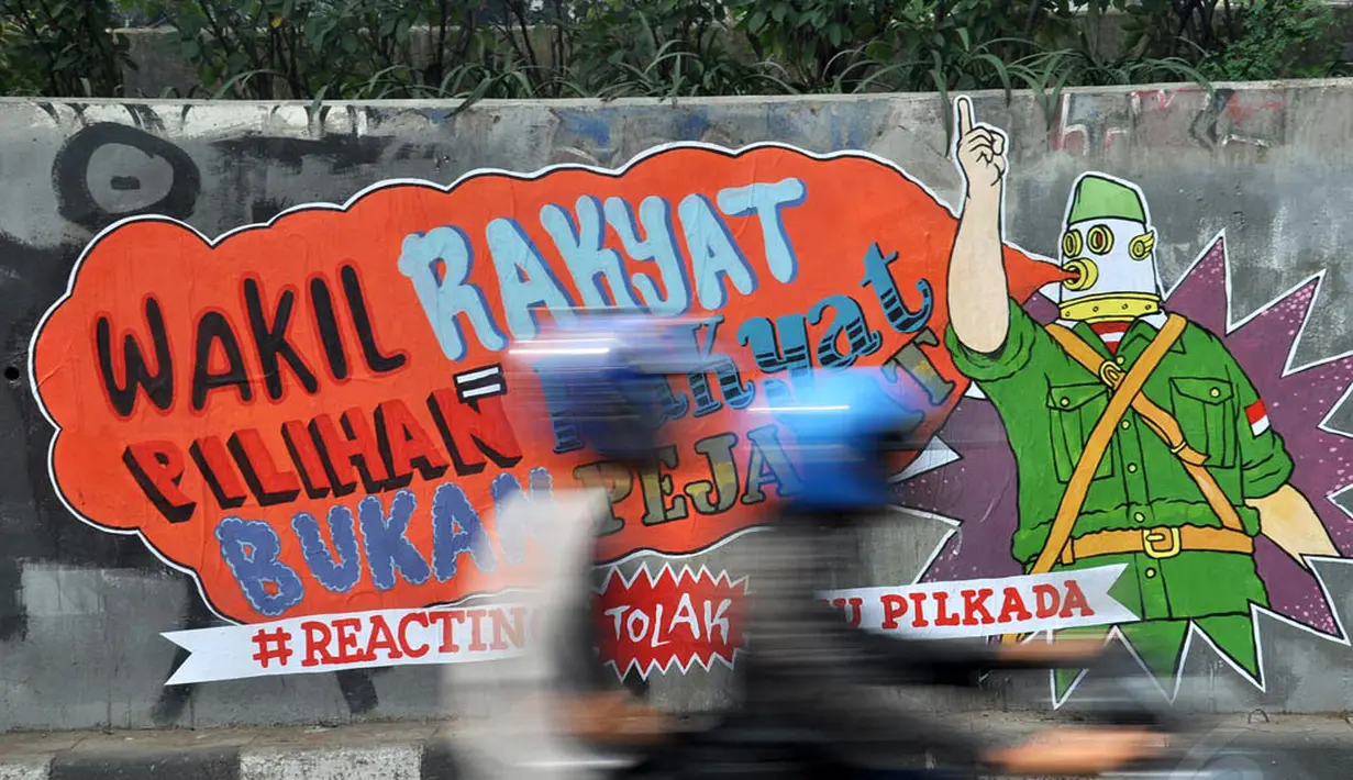 Mural di tembok fly over kawasan Pejompongan tersebut bertuliskan 'Waki Rakyat = Pilihan Rakyat Bukan Pejabat # Reacting Tolak RUU Pilkada' , Jakarta, (28/9/14). (Liputan6.com/Miftahul Hayat) 