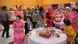 Menkes, Nila F Moeloek (kedua kiri) bersama Menteri KKP, Susi Pudjiastuti (ketiga kiri) menghadiri hari jadi Polisi Wanita (Polwan) yang ke-69 di ruang aula Perguruan Tinggi Ilmu Kepolisian (PTIK), Jakarta, Senin (11/9). (Liputan6.com/Faizal Fanani)