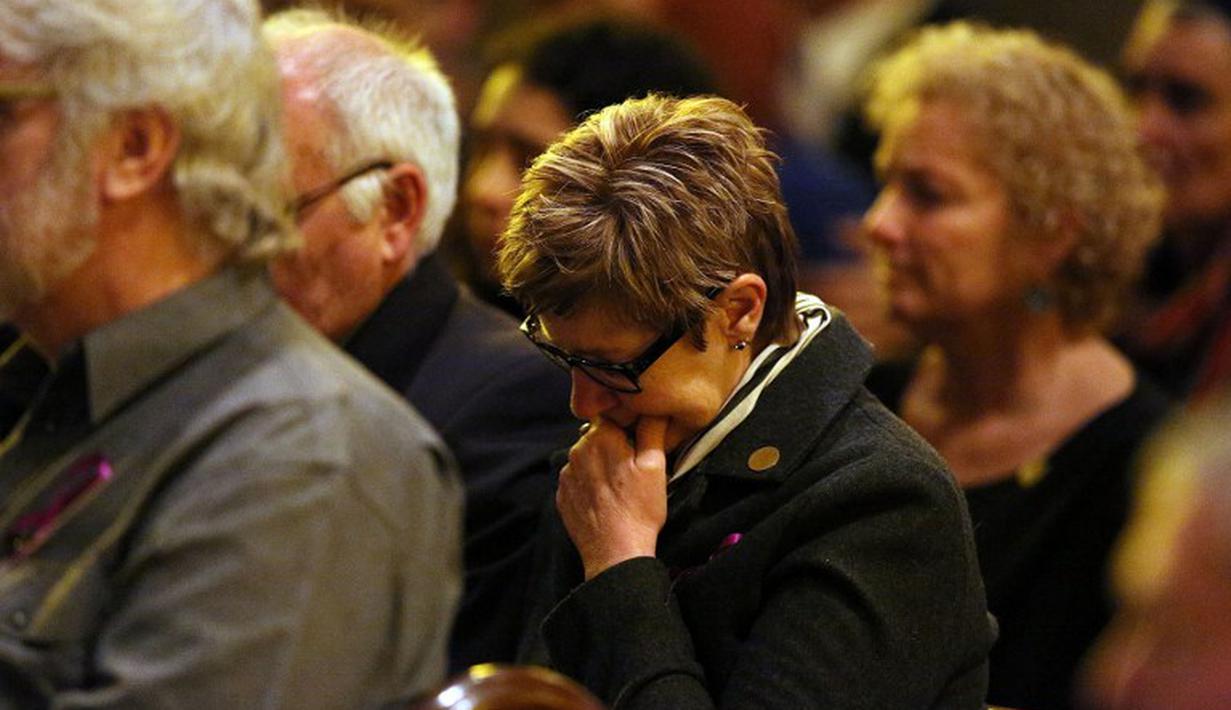 Misa tersebut dihadiri ratusan orang termasuk para anggota keluarga yang berduka, Australia, Kamis (7/8/14). (AFP PHOTO/POOL/Graham DENHOLM)