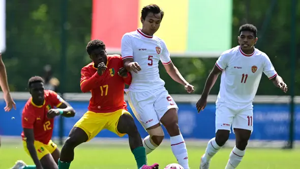 <p>Timnas Indonesia U-23 Vs Timnas Guinea U-23. (Bola.com/Dok.AFP/MIGUEL MEDINA).</p>
