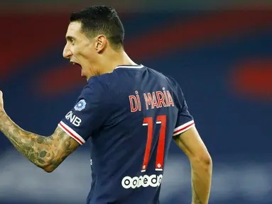 Penyerang Paris Saint-Germain (PSG), Angel Di Maria, melakukan selebrasi usai mencetak gol ke gawang Renners pada laga Liga Prancis di Stadion Parc des Princes, Sabtu (7/11/2020). PSG menang dengan skor 3-0. (AP/Christophe Ena)