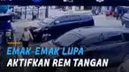 Petugas parkir tampak panik dan berusaha menahan laju mobil agar tak terjadi kecelakaan.