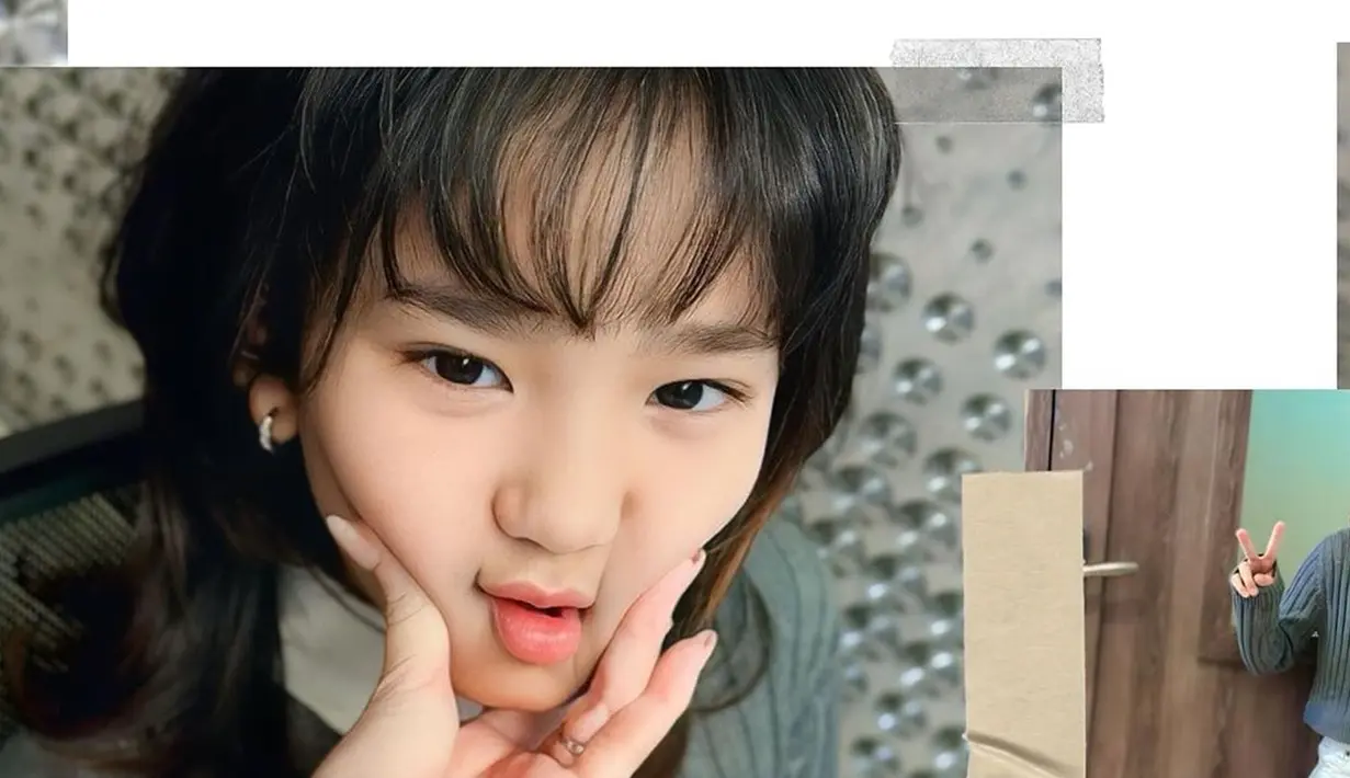 Tampil dengan rambut berponi, Bilqis disebut bak orang Korea. Bilqis dan Ayu Ting Ting memang sering kali dipuji netizen mirip orang Korea. Bahkan banyak yang menyebut jika anak semata wayang Ayu Ting Ting ini cocok debut menjadi idol Korea. Usianya kini menginjak 10 tahun, Bilqis makin cantik. Tak hanya rambutnya, penampilan Bilqis juga membuatnya semakin mirip orang Korea. (Liputan6.com/IG/@ayutingting92)