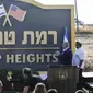 PM Israel Benjamin Netanyahu (kedua dari kanan) dan Dubes AS untuk Israel David Friedman (kiri) bertepuk tangan saat peresmian nama "Trump Heights" (Dataran Tinggi Trump) untuk sebuah permukiman di dataran tinggi Golan Heights (AFP)