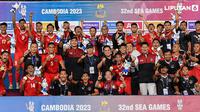 Banner Infografis Timnas Indonesia U-22 Raih Medali Emas SEA Games 2023. (Foto: Nhac NGUYEN / AFP)
