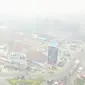 Suasana Pekanbaru di Jalan HR Soebrantas yang diselimuti kabut asap karhutla Riau. (Liputan6.com/Istimewa/M Syukur)