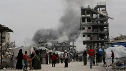 Sejumlah pejabat pertahanan sipil Gaza mengatakan kepada AFP setidaknya 80 orang tewas akibat pengeboman Israel pada 14 Mei, termasuk 59 orang di bagian utara. (Bashar TALEB/AFP)