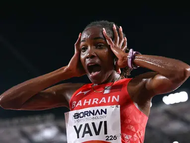 Atlet Bahrain Winfred Yavi bereaksi setelah memenangi final 10.000 meter putri pada Asian Games 2026 di Nagoya, Jepang, Kamis (24/9/2026). (MOHD RASFAN / AFP)