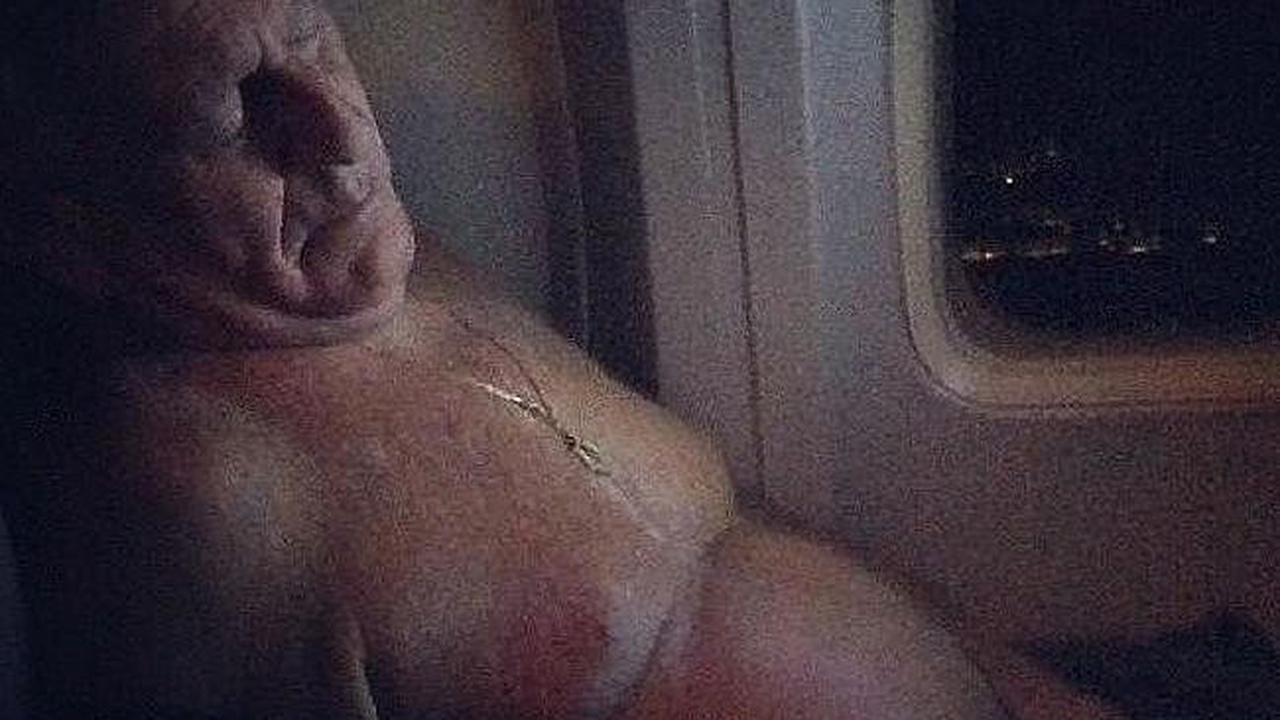 Penumpang lepas baju dan tidur. (Passenger Shaming Source: Supplied)