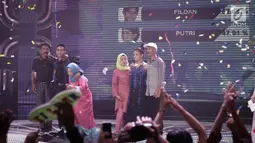 Polling SMS yang menunjukan Fildan memperoleh polling sebesar 52,09 persen dan Putri sebesar 47,91 persen saat pengumuman pemenang Dangdut Academy 4 atau D'Academy 4 di Studio 5 Indosiar, Jakarta, Jumat (19/5). (Liputan6.com/Faizal Fanani)