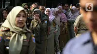 Kegiatan ini rutin dilakukan setiap tahunnya di lingkungan Balai Kota Jakarta saat hari pertama kerja pasca libur Lebaran. (Liputan6.com/Herman Zakharia)