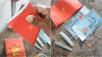 Buka Angpao Terlalu Cepat, Pria Ini Tak Sengaja Robek Uang Kertas di Dalamnya