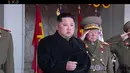 Pemimpin Korea Utara Kim Jong-un saat tengah menghadiri sebuah parade militer di Pyongyang, Korea Utara (8/2). Korea Utara mengadakan parade militer dan demonstrasi di Kim Il Sung Square. (KRT via AP Video)