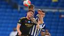 Bek Manchester City Aymeric Laporte melompat saat berebut bola dengan pemain Brighton and Hove Albion, Lewis Dunk pada Pekan ke-35 Liga Inggris di stadion The American Express, Minggu (12/7/2020). Manchester City berpesta gol di markas Brighton. (Adam Davy/Pool via AP)