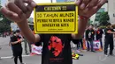 Sejumlah orang melakukan aksi mengenang 10 tahun Munir di Bundaran HI, Jakarta, Minggu (7/12/2014). (Liputan6.com/Miftahul Hayat)