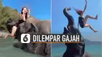 Perempuan itu nampak kaget saat dilempar dan jatuh ke air laut.