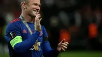 Kapten Manchester United (MU), Wayne Rooney saat perayaan juara Liga Europa 2016/2017. (Soren Andersson / AFP)