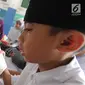 Anak-anak membaca kitab suci Al-Quran di Kampung Quran Alkholidin Cinere,  Depok, Senin (13/5/2019). Momentum bulan Ramadhan 1440 H dimanfaatkan anak-anak usai pulang sekolah untuk membaca dan menghapal Quran secara bersama-sama untuk menambah amalan ibadah puasa. (merdeka.com/Arie Basuki)