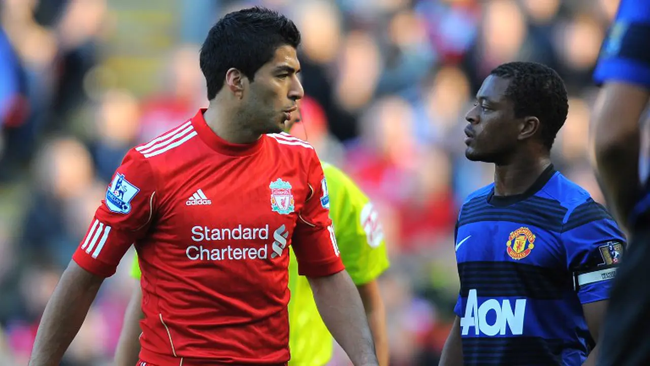 Patrice Evra dan Luis Suarez