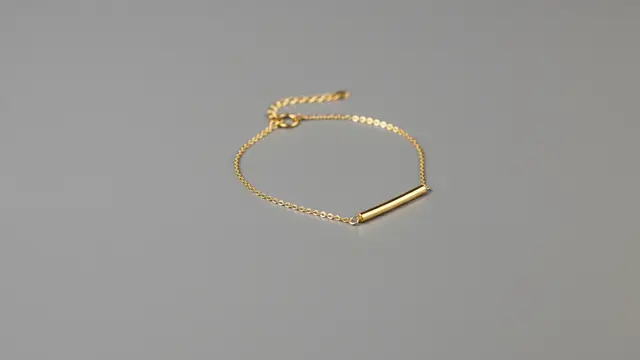 Gelang Emas 24 Karat 5 Gram untuk Tangan Berisi/ Ilustrasi AI