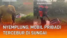 Sebuah mobil pribadi tercebur di sungai mengundang perhatian