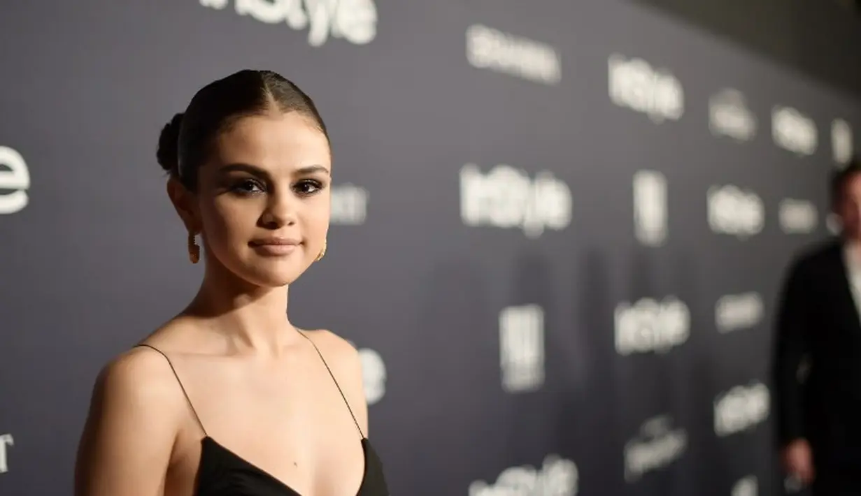 Lalu, mengapa dirinya tak lagi mepedulikan hal itu? Ternyata Selena Gomez percaya bahwa Justin Bieber sudah berubah dan lebih dewasa dari sebelumnya. (MATT WINKELMEYER / GETTY IMAGES NORTH AMERICA / AFP)