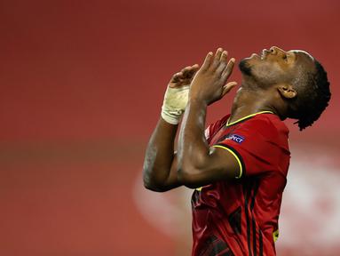 Penyerang timnas Belgia, Michy Batshuayi berselebrasi setelah mencetak gol ke gawang Islandia pada matchday kedua UEFA Nations League A Grup 2 di King Baudouin Stadium, Rabu (9/9/2020) dini hari WIB. Belgia yang sempat tertinggal lebih dulu, menang telak 5-1 atas Islandia. (AP Photo/Francisco Seco)