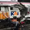 Para pekerja memeriksa kondisi lokomotif Kereta Api Jarak Jauh (KAJJ) Argo Bromo Anggrek dan salah satu gerbong Kereta Rel Listrik (KRL) Commuter Line yang mengalami kecelakaan di Stasiun Bekasi Timur, Bekasi, Jawa Barat, Selasa 28 April 2026. (AP Photo/Tatan Syuflana)