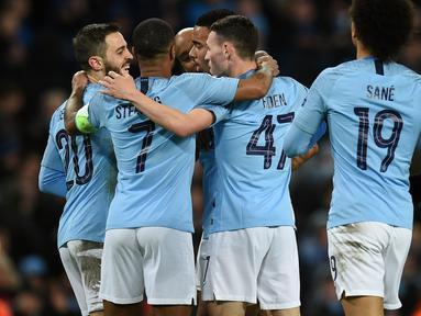 Perayaan gol Man City pada leg kedua, babak 16 besar Liga Champions yang berlangsung di Stadion Etihad, Manchester, Rabu (13/3). Man City menang 7-0 atas Schalke. (AFP/Oli Scarff)