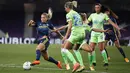 Pemain Lyon, Eugenie Le Sommer, berusaha melewati pemain Wolfsburg pada laga Liga Champions Wanita di Stadion Anoeta, Spanyol, Senin (31/8/2020). Lyon menang 3-1 atas Wolfsburg. (Clive Brunskill/Pool via AP)