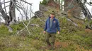 Presiden Rusia, Vladimir Putin ketika menghabiskan waktu di kawasan hutan pegunungan Siberia, pada 6 Oktober 2019. Presiden Vladimir Putin menikmati hari lahirnya dengan mendaki pegunungan dan memetik jamur liar pada akhir pekan lalu. (Alexey DRUZHININ / Sputnik / AFP)