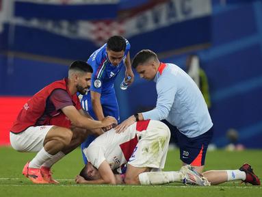 Reaksi para pemain Kroasia usai hanya imbang atas Italia pada matchday terakhir Grup B Euro 2024, Selasa (25/6/2024) dini hari WIB.  (AP Photo/Petr David Josek)