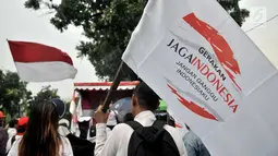 Massa GJI mendengarkan orasi saat menggelar aksi di depan Balai Kota, Jakarta, Kamis (29/11).  Aksi tersebut menuntut Gubernur DKI Jakarta Anies Baswedan untuk mencabut izin penyelanggaraan Reuni 212 pada 2 Desember 2018. (Merdeka.com/Iqbal S. Nugroho)