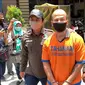 Polresta Sidoarjo menangkap buroran imigrasi Khaled WM Owda (28). (Dian Kurniawan/Liputan6.com)