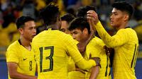 Timnas Malaysia merayakan gol ke gawang Timor Leste dalam leg kedua putaran pertama kualifikasi Piala Dunia 2022 di Stadion Nasional Bukit Jalil, Kuala Lumpur (10/6/2019), (Bola.com/Dok. FAM)