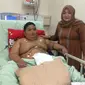 Selang mesin ventilator‎ yang terpasang di mulut Rizki Rahmat Ramadhan (10), bocah obesitas asal Palembang, akhirnya dilepas. (Liputan6.com/Nefri Inge)