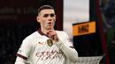 Pemain Manchester City, Phil Foden mrayakan gol penentu kemenangan timnya ke gawang Bournemouth pada laga lanjutan Liga Inggris 2023/2024 yang berlangsung di Vitality Stadium, Bournemouth, Inggris, Minggu (25/02/2024) dini hari WIB. (AFP/Adrian Dennis)