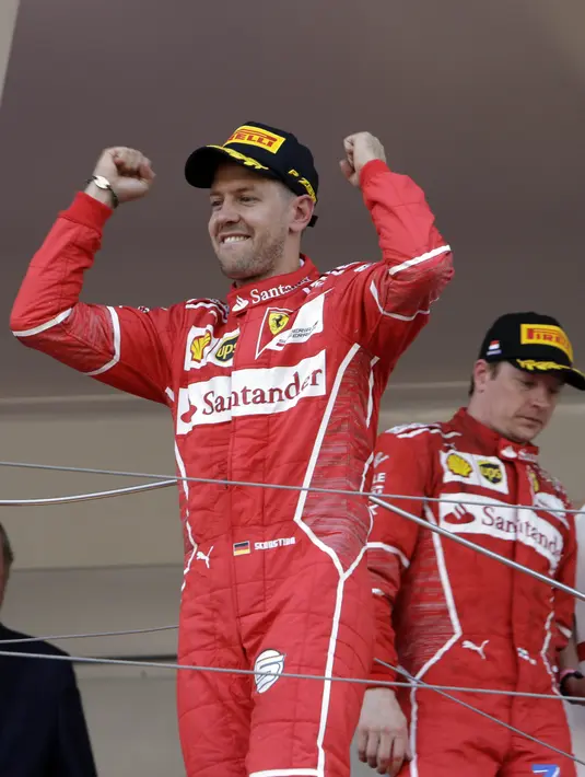 Ekspresi Sebastian Vettel usai menjuarai balapan F1 GP Monako mengalahkan Kimi Raikkonen di Monte-Carlo, (28/5/2017). (AP/Claude Paris)