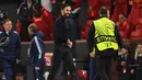 Pelatih Manchester United, Ruben Amorim tersenyum setelah menang atas Lyon dalam laga lanjutan Liga Europa 2024/2025 di Old Trafford, Manchester, Inggris, Jumat (18/04/2025) dini hari WIB. (AFP/Oli Scarff)