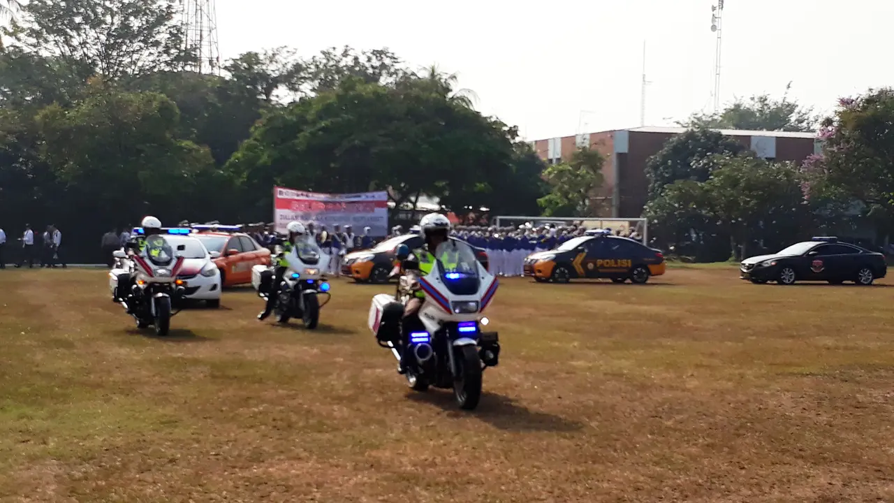 Jalannya gelar pasukan penyambutan kedatangan official dan atlet Asian Games 2018 di Bandara Internasional Soekarno Hatta, Kota Tangerang, Kamis (2/8/2018). (Liputan6.com/Pramita Tristiawati)