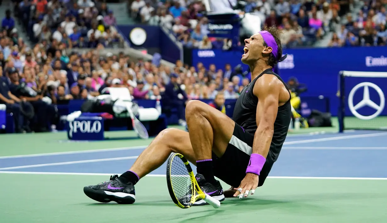 Ekspresi petenis Spanyol, Rafael Nadal usai mengalahkan Daniil Medvedev dari Rusia pada babak final AS Terbuka 2019 di New York, Minggu (8/9/2019). Nadal menjadi juara melalui pertarungan lima set 7-5, 6-3, 5-7, 4-6, dan 6-4. (AP Photo/Eduardo Munoz Alvarez)