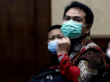 Mantan Wakil Ketua DPR Azis Syamsuddin bersiap mengikuti sidang lanjutan di Pengadilan Tipikor Jakarta, Kamis (23/12/2021). Azis Syamsuddin merupakan terdakwa dugaan suap penanganan perkara korupsi di Lampung Tengah. (Liputan6.com/Helmi Fithriansyah)