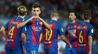 Ekspresi striker Barcelona, Munir El Haddadi, setelah mencetak gol kedua ke gawang Sevilla pada laga leg pertama Piala Super Spanyol 2016 di Ramon Sanchez Pizjuan, Sevilla, Senin (15/8/2016) dini hari WIB. (AFP/Jorge Guerrero)