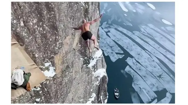 Duh, Aksi Pria Terjun dari Tebing Setinggi 40,5 Meter ke Danau Es Ini Nekat Banget