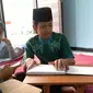 Anak penyandang disabilitas belajar membaca Al-Quran. Foto: Y-AMI.