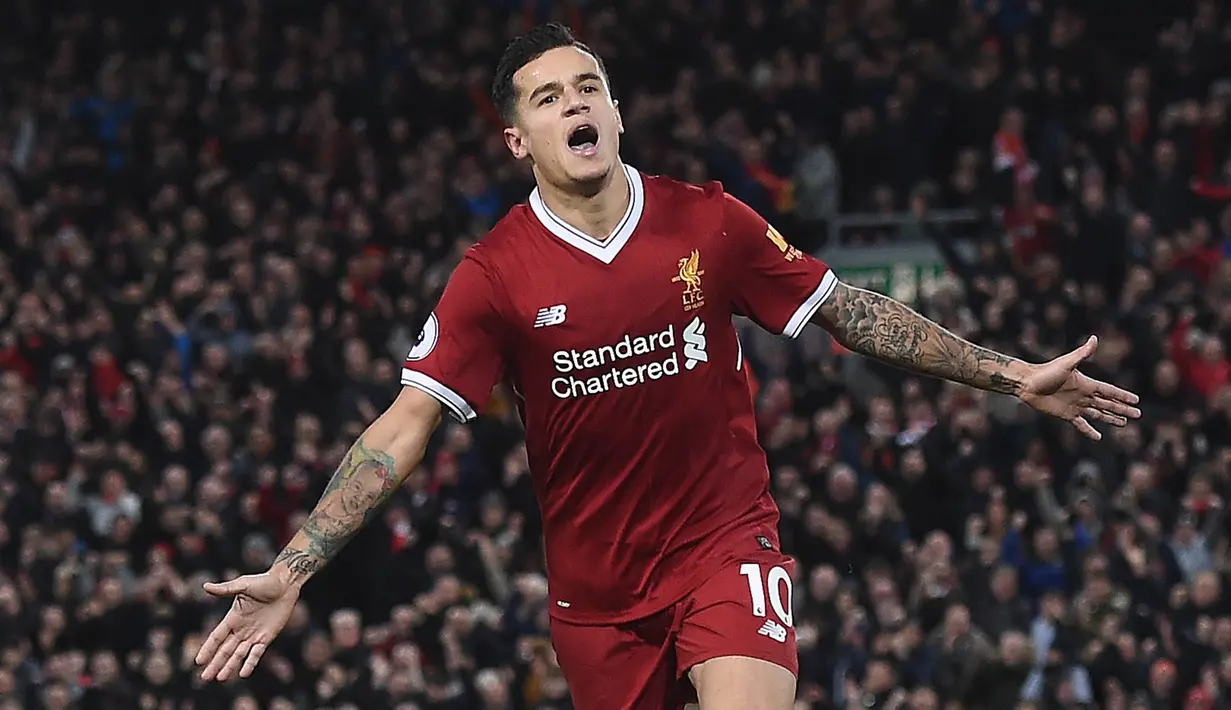 Gelandang Liverpool, Philippe Coutinho, merayakan gol yang dicetaknya ke gawang Southampton pada laga Premier League di Stadion Anfield, Liverpool, Sabtu (18/11/2017). Sepanjang karier di Liverpool, Coutinho mencetak 54 gol. (AFP/Paul Ellis)