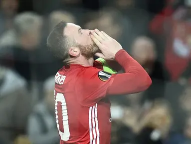 Manchester United meraih kemenangan 4-0 atas Feyenoord pada matchday kelima Grup A Liga Europa 2016-2017, di Stadion Old Trafford, Jumat (25/11/2016) dini hari WIB. Wayne Rooney mencetak gol pertama MU. (AFP/Oli Scarff)