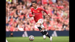 Catatan menarik pun tersaji usai Cristiano Ronaldo membobol gawang Newcastle. Ya, setelah 12 tahun dan 124 hari, ia kembali mencetak gol untuk Manchester United. (Foto: AFP/Oli Scarff)